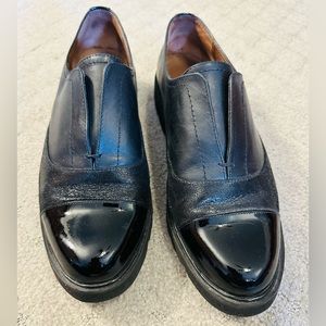 Donald J Pliner slip on loafers with black leather and patent leather. Size 9.
